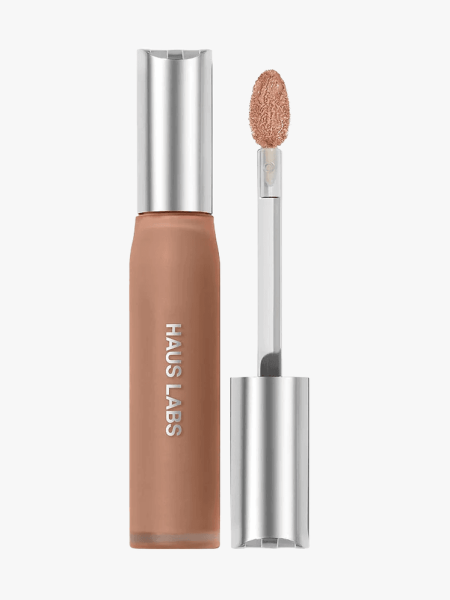 Haus Labs Triclone Skin Tech Hydrating + De-puffing Concealer in branded component on a light gray background