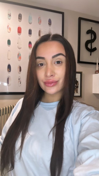 Selfie of Angela Trakoshis after using the Shark hair dryer and attachments with smooth blownout hair.